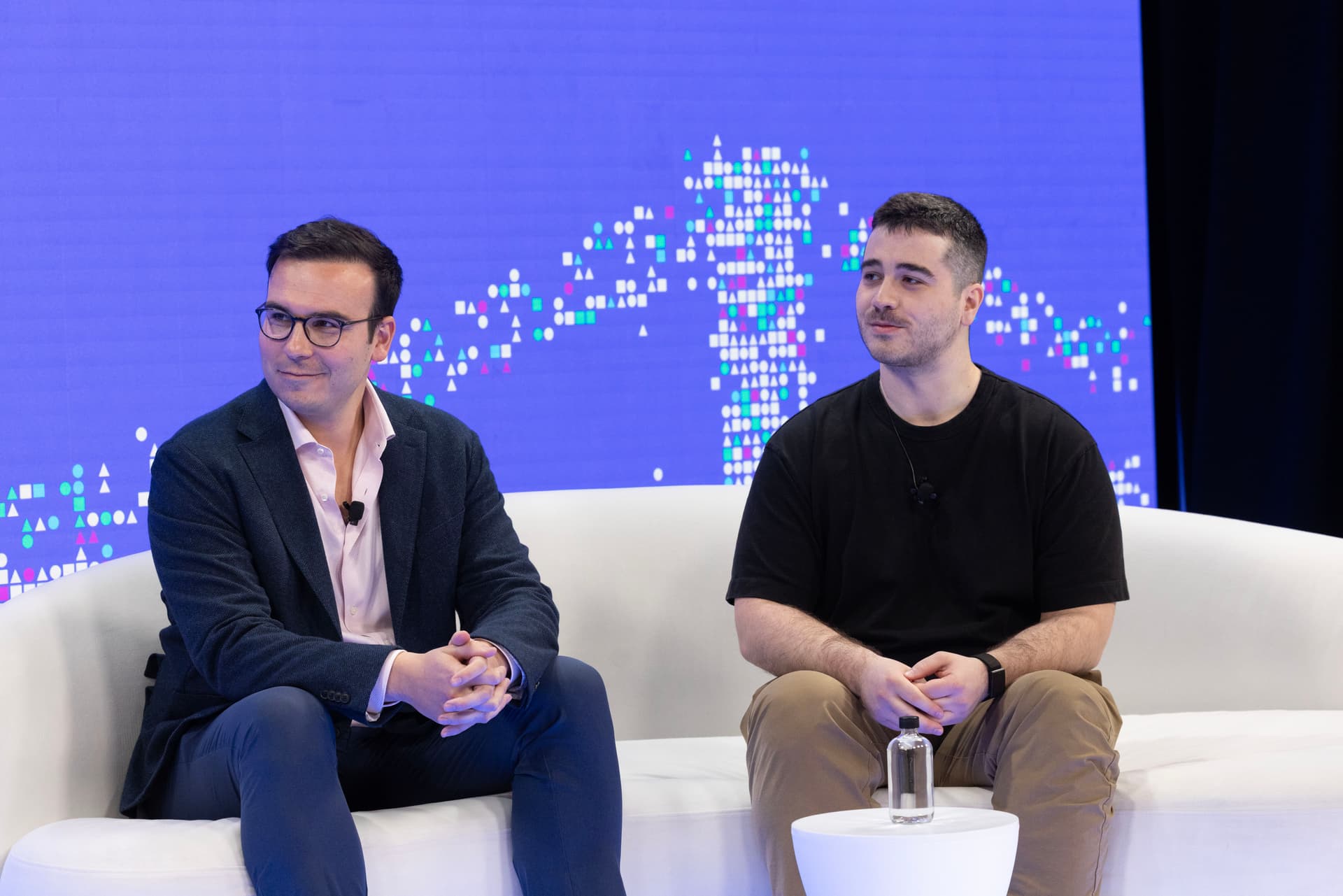 Erik Reppel, Edward Woodford, and Guillaume onstage at CoBuild 2026